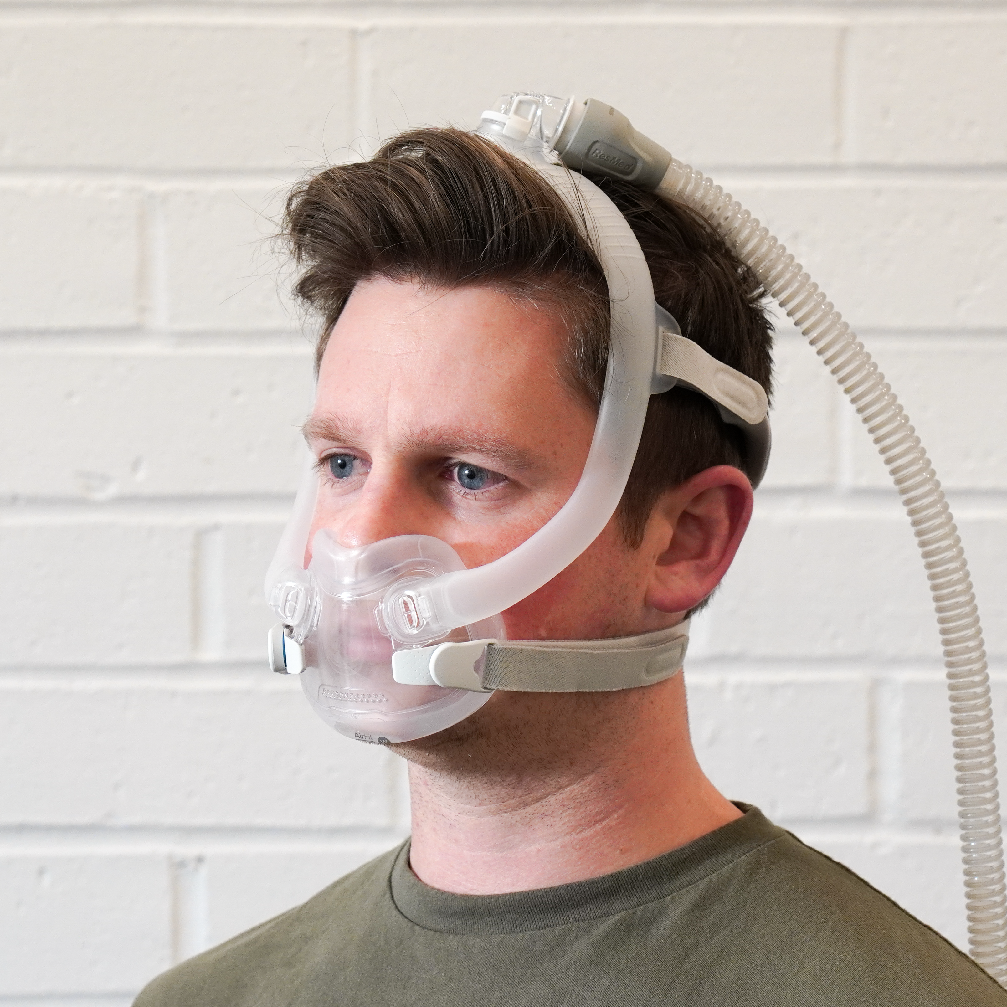 ResMed AirFit F30i mask with top-of-head tubing in use