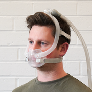 ResMed AirFit F30i mask with top-of-head tubing in use