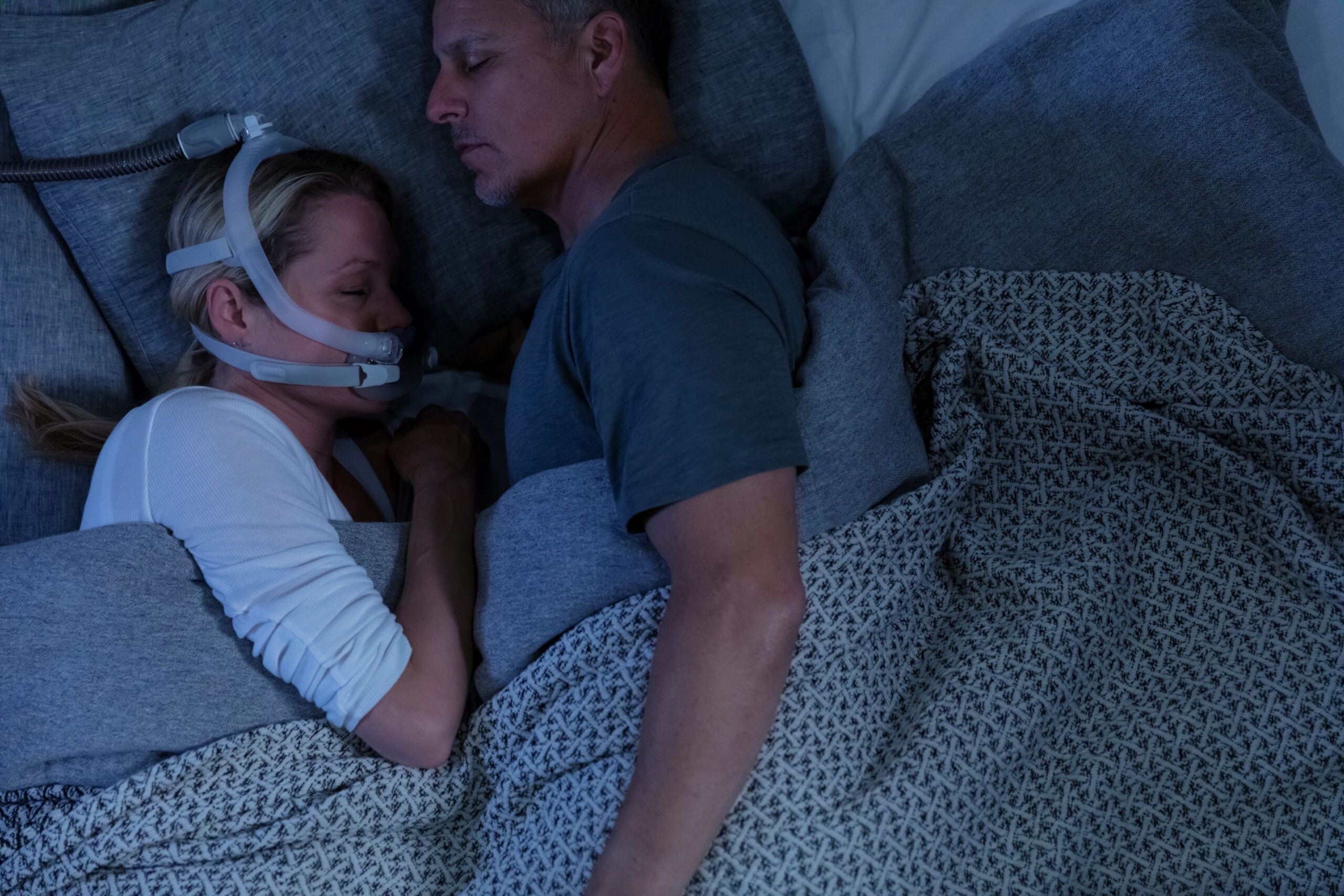 Person sleeping with the ResMed AirFit X30i CPAP mask